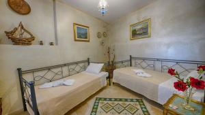 Postel nebo postele na pokoji v ubytování Feakia apartment 2