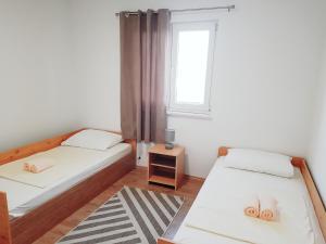 Posteľ alebo postele v izbe v ubytovaní Apartments Kalajica