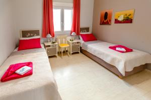 Postel nebo postele na pokoji v ubytování Skandalakis Homes & Apartments