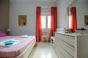 Postel nebo postele na pokoji v ubytování Skandalakis Homes & Apartments