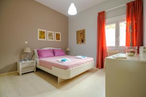 Postel nebo postele na pokoji v ubytování Skandalakis Homes & Apartments