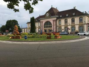 a building with a roundabout in front of a street at Studio Lora RM 1221 in Saint-Louis