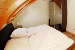 Postel nebo postele na pokoji v ubytování Ferienhaus "Zur Sprotte" in Glowe