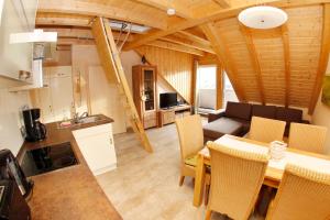 Posezení v ubytování Ferienhaus "Zur Sprotte" in Glowe