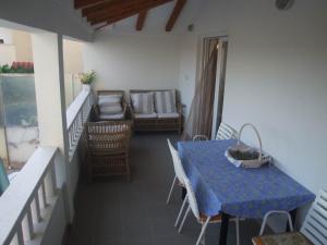 a room with a table and chairs and a couch at Villa Mandina in Sevid