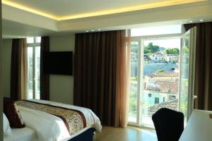 Postel nebo postele na pokoji v ubytování Hotel Brais