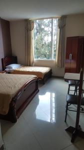 מיטה או מיטות בחדר ב-Hotel Del River