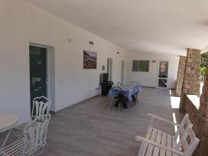 TV a/nebo společenská místnost v ubytování Residence Melograno