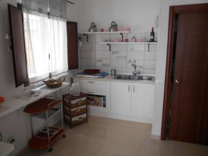 A kitchen or kitchenette at La Corte Dei Naviganti