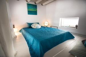 Postel nebo postele na pokoji v ubytování Plori House