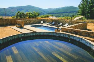 a swimming pool in a yard with a wooden bridge at Casa Bouchon Hotel Boutique in San Javier