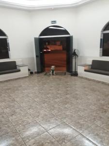 a room with a door and a tile floor at Araca Hotel in Araçatuba