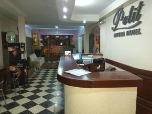 a bar in a restaurant with a cash register at Petit Rivera Hotel in Rivera
