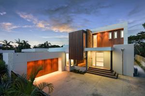 a modern house with a lit up driveway at Hidden Paradise in Gold Coast
