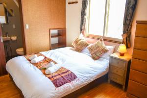 Postel nebo postele na pokoji v ubytování Panketo Lodge & Yoga Studio