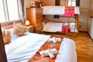 Postel nebo postele na pokoji v ubytování Panketo Lodge & Yoga Studio