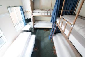 Letto o letti in una camera di Sakura Hotel Jimbocho