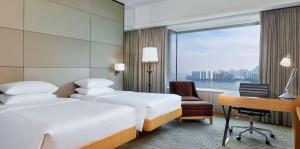 Cama ou camas em um quarto em Hyatt Regency Hong Kong, Sha Tin