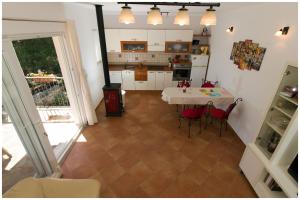Kuchyň nebo kuchyňský kout v ubytování Apartments FRAGOLINA