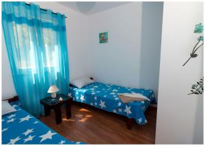 Postel nebo postele na pokoji v ubytování Apartments FRAGOLINA