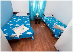Postel nebo postele na pokoji v ubytování Apartments FRAGOLINA