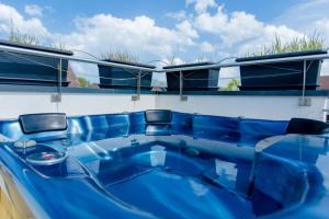 a blue bath tub in front of a building at Apartamenty Villa Baltica Rewal in Rewal