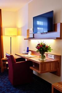 TV a/nebo společenská místnost v ubytování Hotel am Dom