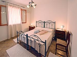 Postel nebo postele na pokoji v ubytování Agriturismo Sa Suerera