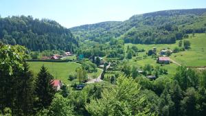 a small village in a valley in the mountains at MAGNOLIA Duszniki Zdrój in Duszniki Zdrój