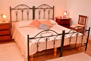Postel nebo postele na pokoji v ubytování Agriturismo Sa Suerera