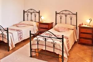 Postel nebo postele na pokoji v ubytování Agriturismo Sa Suerera