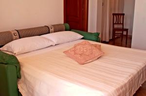 Postel nebo postele na pokoji v ubytování Agriturismo Sa Suerera