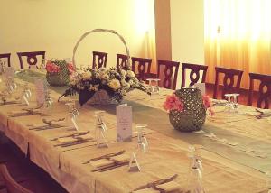 a table with baskets of flowers on top of it at Agriturismo Agri Armonia in San Lucido