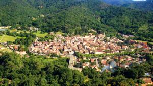 an aerial view of a town in the mountains at Les Capena 2 in Collobrières