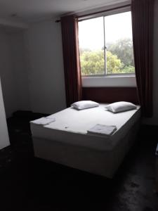 Postel nebo postele na pokoji v ubytování The Kingston Hotel