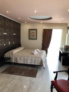 Posteľ alebo postele v izbe v ubytovaní Selefkos Palace
