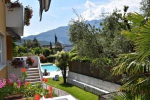 a view of a backyard with a swimming pool at Villa Dina in Riva del Garda
