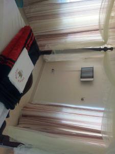 Ένα ή περισσότερα κρεβάτια σε δωμάτιο στο Palace Hotel