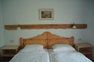 
Un ou plusieurs lits dans un hébergement de l'établissement Garni Hotel Berc
