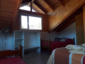 Tempat tidur dalam kamar di Apart hotel Pehuenia