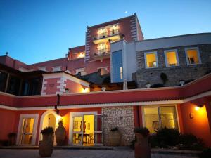 a building sitting on the side of a hill at Hotel Boutique Il Castellino Relais in Vieste