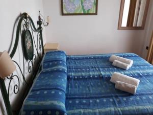 A bed or beds in a room at Villa Veronica