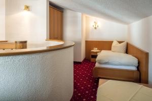 Posteľ alebo postele v izbe v ubytovaní Apart Römerhof