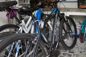 two bikes parked next to each other in a garage at Casa da Igreja Velha in Furnas