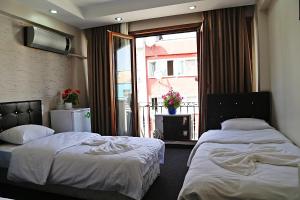 Postel nebo postele na pokoji v ubytování holiday family apart