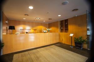 a lobby with a reception desk in a building at Nuria in Tarragona
