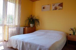 Postel nebo postele na pokoji v ubytování Villa Orchidea
