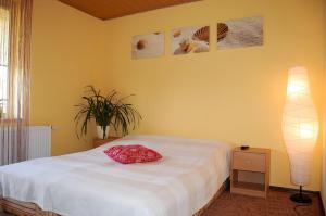 Postel nebo postele na pokoji v ubytování Villa Orchidea