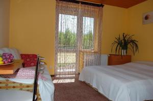 Postel nebo postele na pokoji v ubytování Villa Orchidea