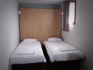 Кровать или кровати в номере B&B HOTEL Chatellerault
